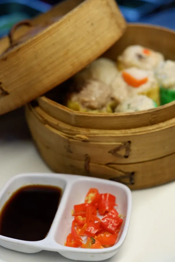 Steamed dim sum basket with two dipping sauces