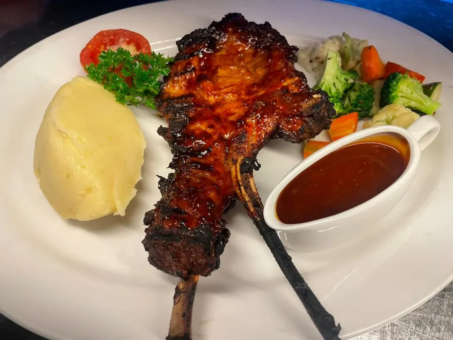 Char grilled lamb with mash, vegetables and gravy