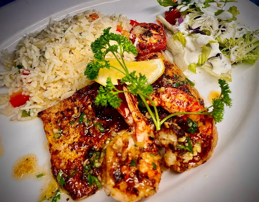 Glazed king prawns with fried rice and a garden salad