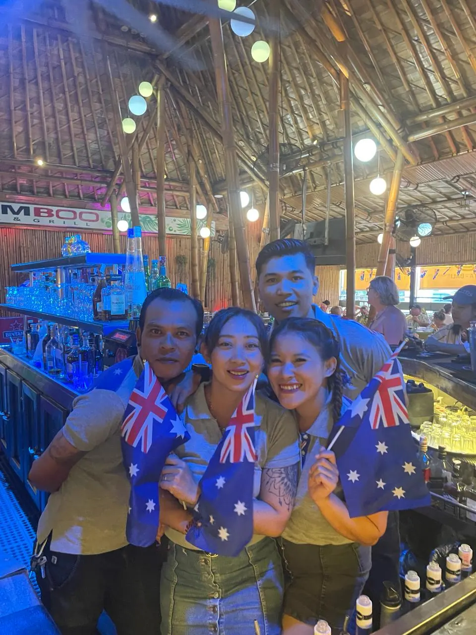 Guests celebrating with Australian flags at the bar