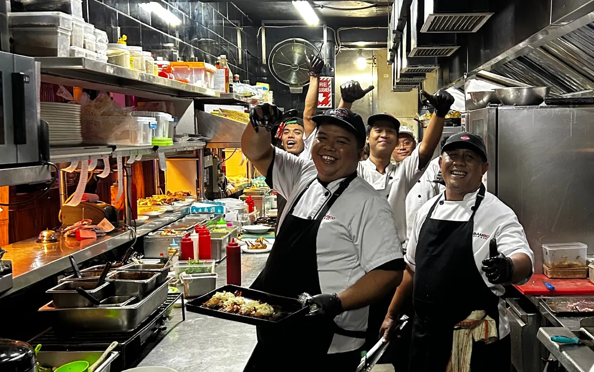 The Bamboo kitchen brigade working the grill line during service